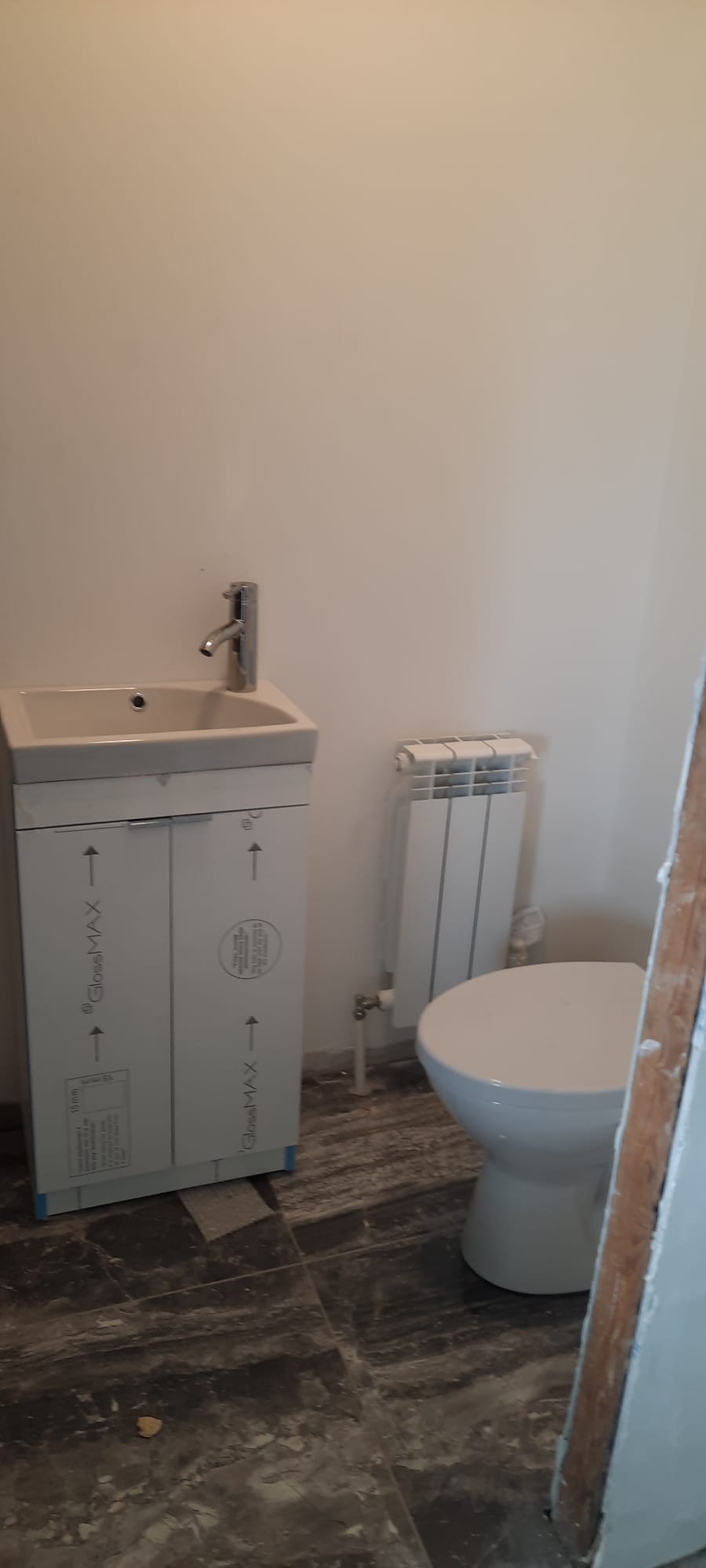 Cloakroom suite and radiator